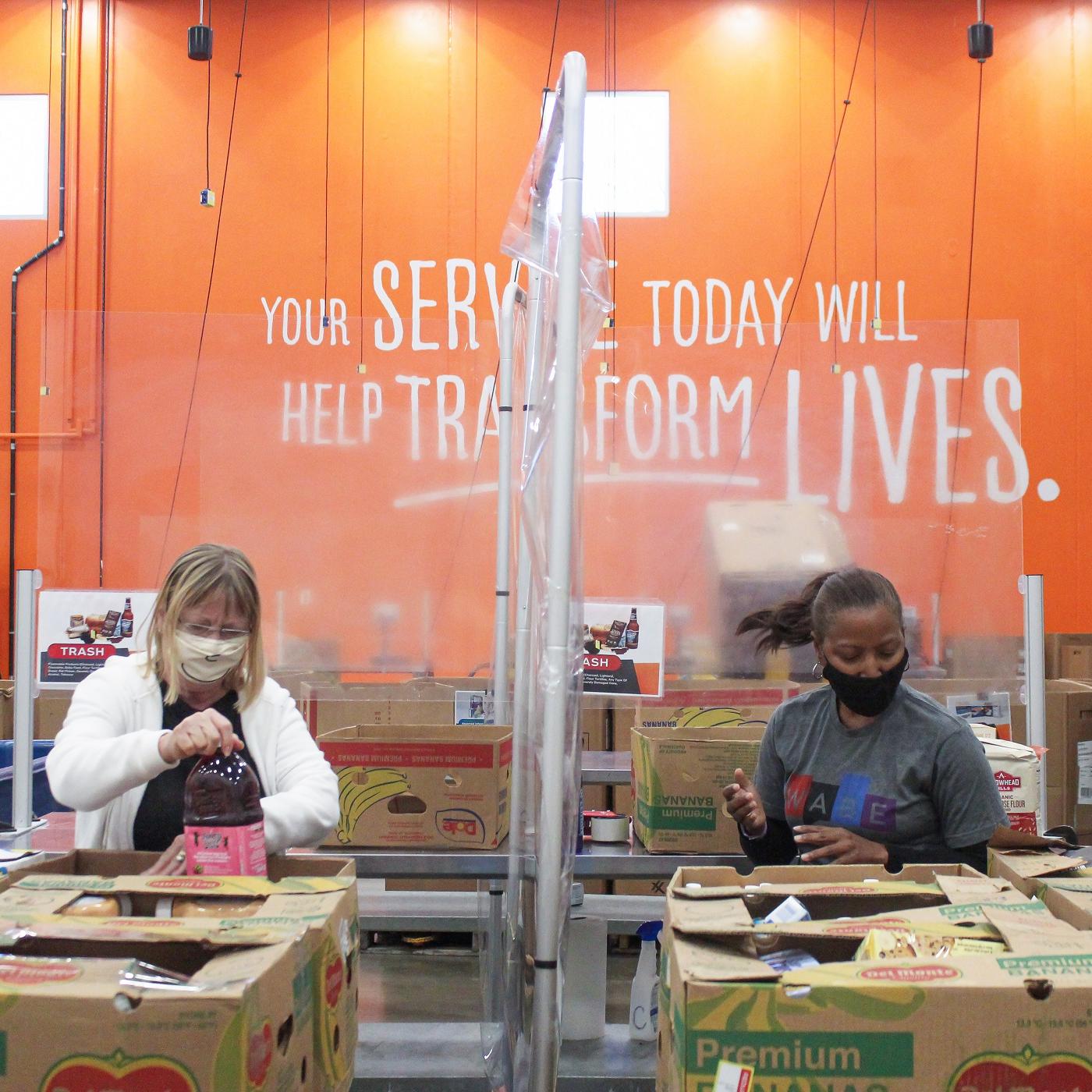 Volunteers packing boxes at the Atlanta Community Food Bank.